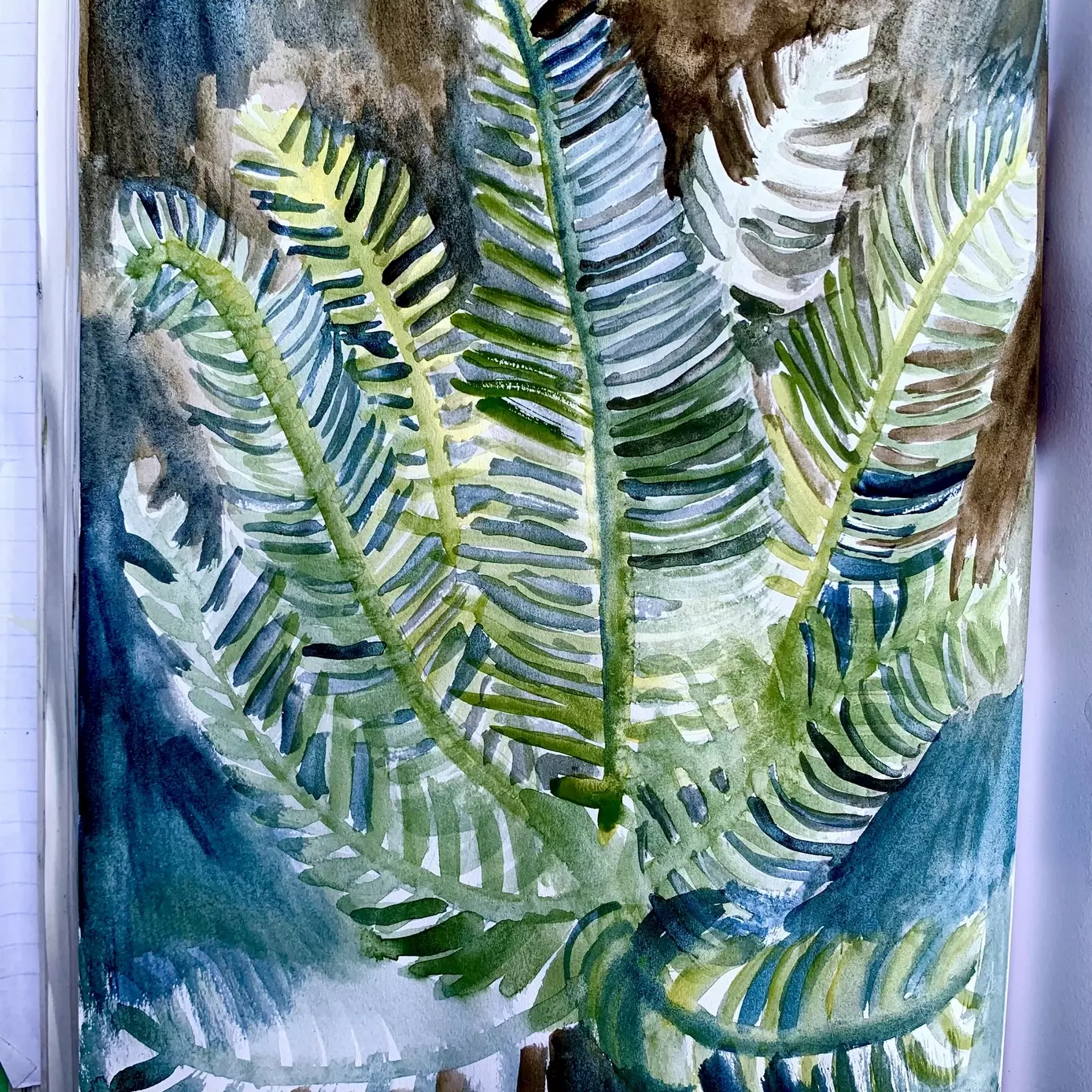 a watercolour painting of a fern in the forest. The fern is painted in shades of green, brown and blue, showing the colours bleeding into each other and the texture of the paint